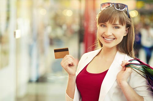 Woman holding credit card